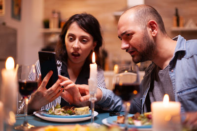 Portrait of man sitting at restaurant