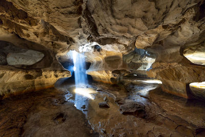 Low angle view of waterfall in cave