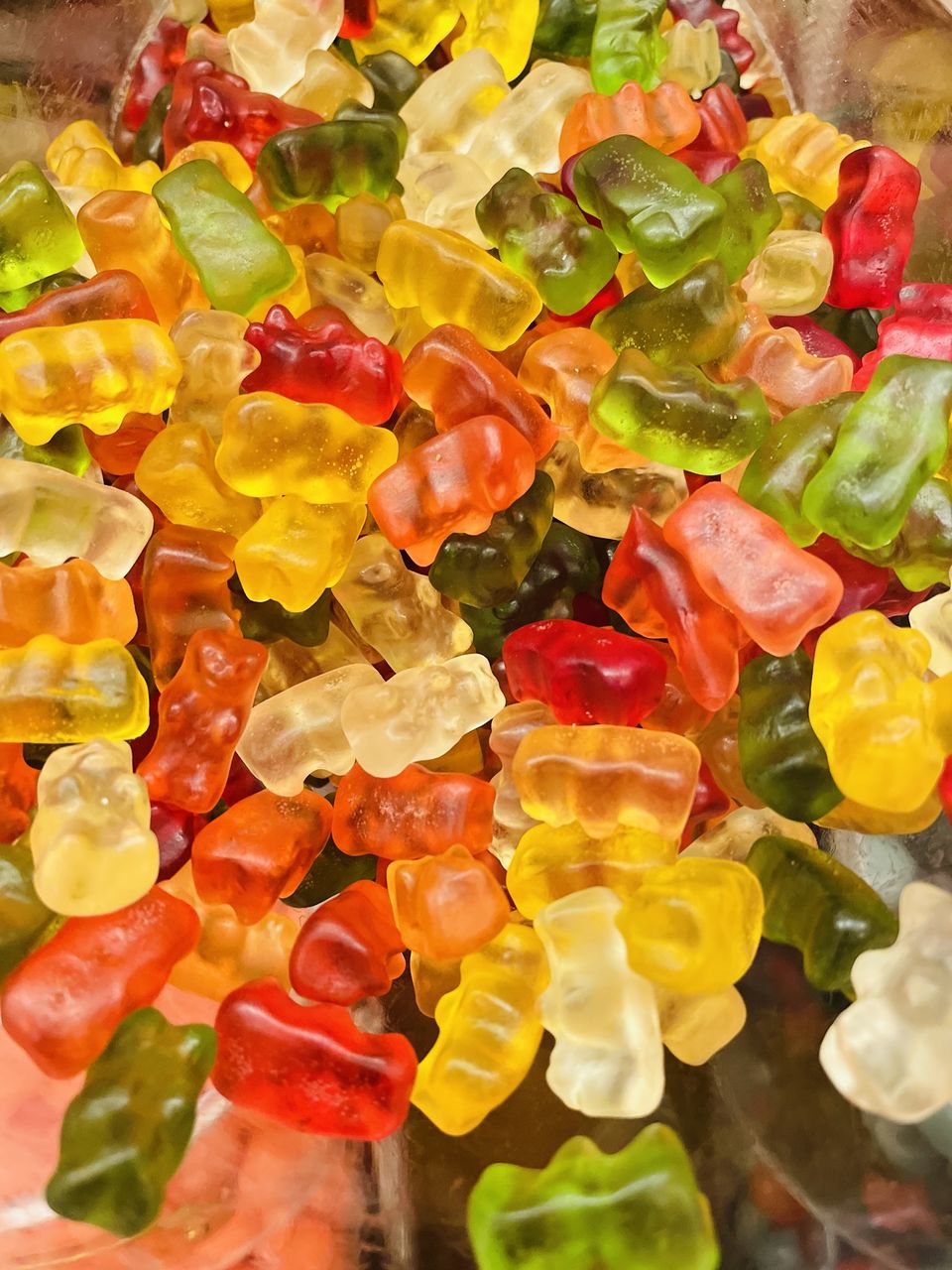 gummi candy, wine gum, food, multi colored, food and drink, dessert, candied fruit, confectionery, candy, yellow, flower, large group of objects, abundance, no people, produce, freshness, petal, still life, variation, indoors, close-up, full frame, sweet food, fruit, gumdrop, backgrounds, sweetness, high angle view, healthy eating