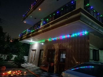 Low angle view of illuminated building at night