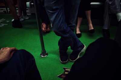 Low section of men sitting on floor