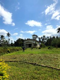 House on field against sky