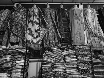 Clothes hanging in store for sale at market stall