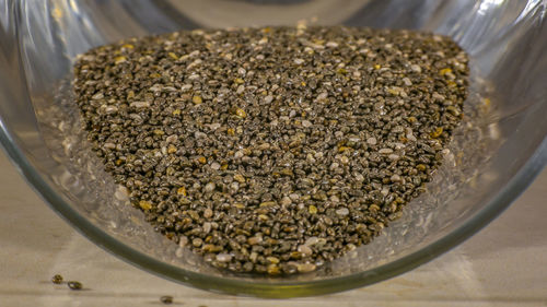 High angle view of coffee beans in glass on table