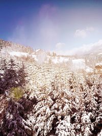 Scenic view of snow covered landscape against sky