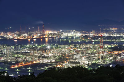 High angle view of illuminated buildings in city at night