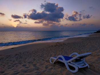 Scenic view of beach against sky during sunset