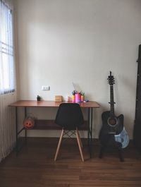 Empty chairs on table at home