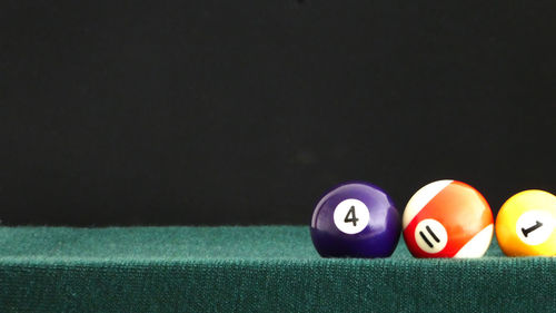 Close-up of pool balls on table