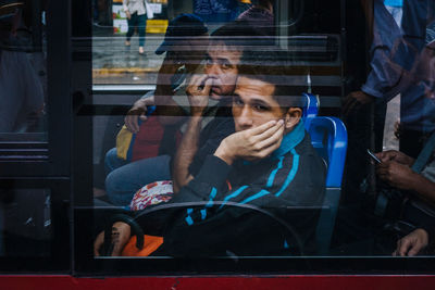 Portrait of man sitting in train