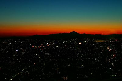 Illuminated cityscape at night