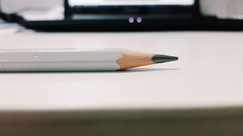 Close-up of pencil on table