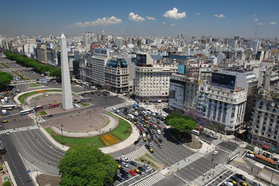 High angle view of obelisco de buenos aires by buildings in city