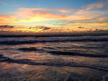 Scenic view of sea against cloudy sky