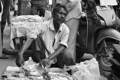 Man sitting at market