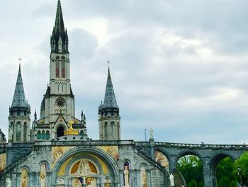 View of historic building against cloudy sky