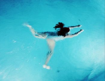 Woman swimming in sea