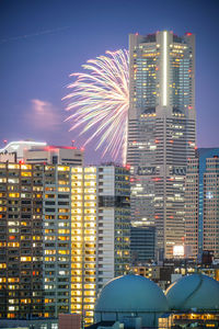 Illuminated buildings in city at night