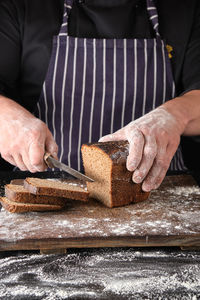 Midsection of man preparing food