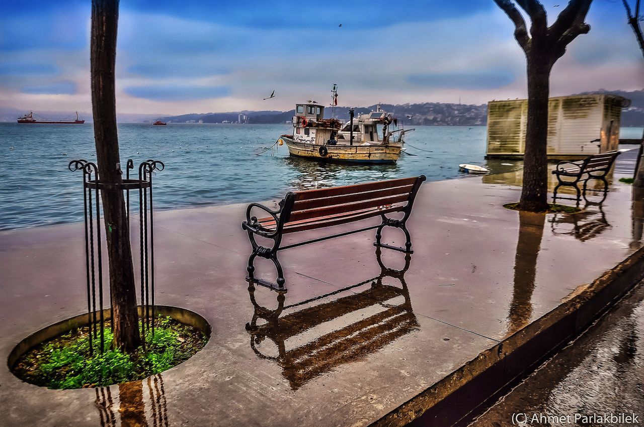 water, sea, tranquility, sky, tranquil scene, nautical vessel, scenics, pier, nature, horizon over water, moored, beauty in nature, boat, transportation, mode of transport, absence, idyllic, railing, blue, no people