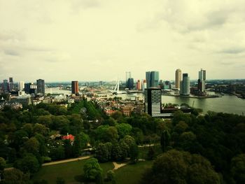 Cityscape against cloudy sky