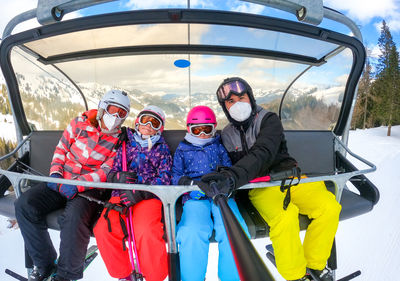 Low angle view of people on snow