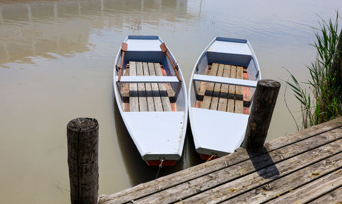 Two parked boats on neusidler lake burgenland, austria, waiting for travelers.