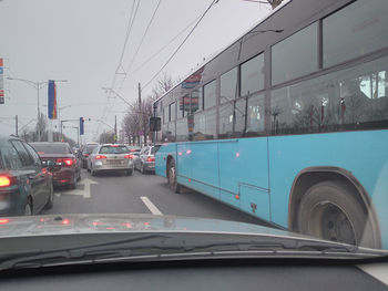 Cars on road seen through car window