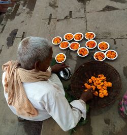 High angle view of man serving food