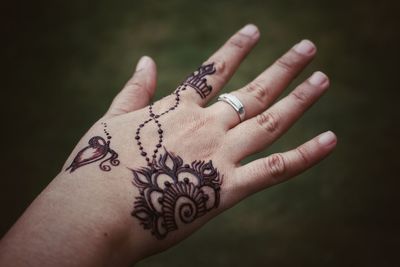 Close-up of woman hand with tattoo