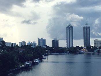 Cityscape against cloudy sky