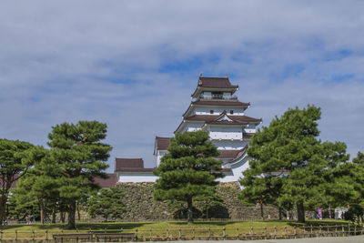 View of trees and buildings against sky