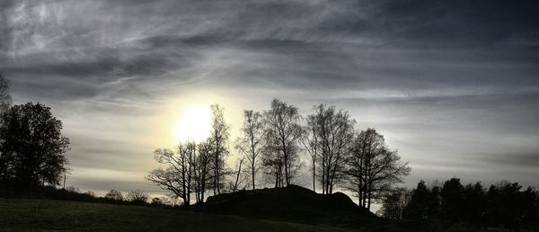 Scenic view of landscape against cloudy sky