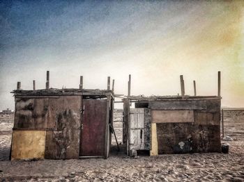Built structure on beach against clear sky