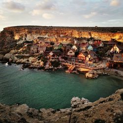 High angle view of houses by sea