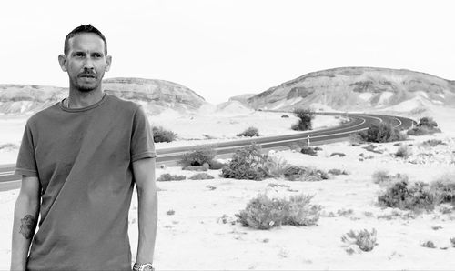 Man standing on sand at desert