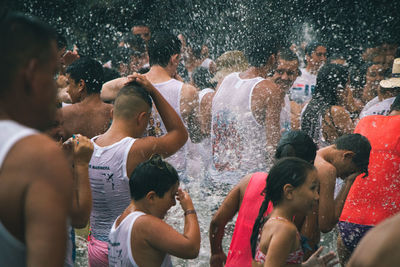 Group of people enjoying in water