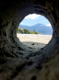 Surface level of beach seen through hole