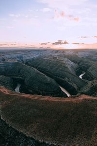 High angle view of land against sky during sunset