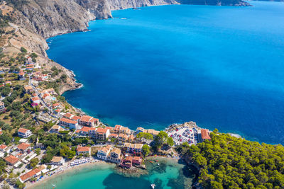 High angle view of buildings by sea