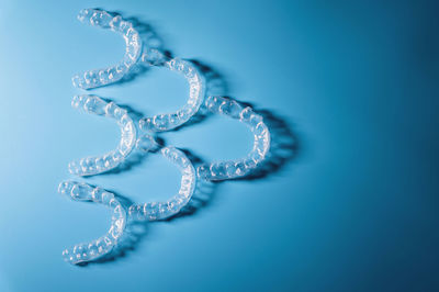 Close-up of bubbles against blue background