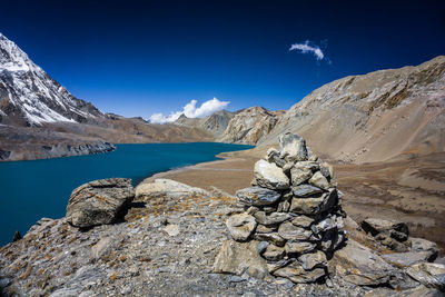 Scenic view of rocky mountains against blue sky