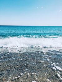 Scenic view of sea against clear blue sky