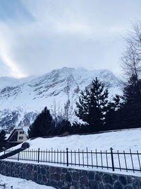 Scenic view of snow covered mountains against sky