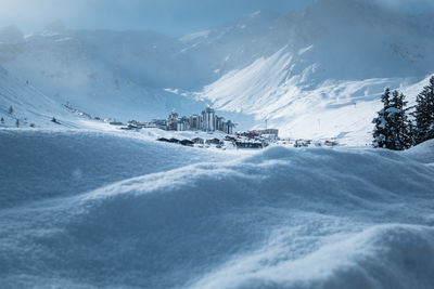 Scenic view of snowcapped mountains against sky