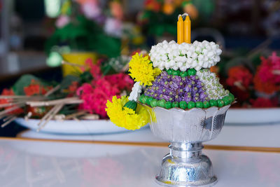 Close-up of multi colored flower on table