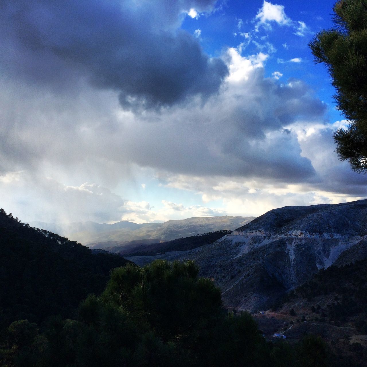 mountain, sky, tranquil scene, tranquility, scenics, beauty in nature, cloud - sky, mountain range, landscape, nature, tree, cloud, cloudy, non-urban scene, idyllic, silhouette, outdoors, non urban scene, sunlight, remote