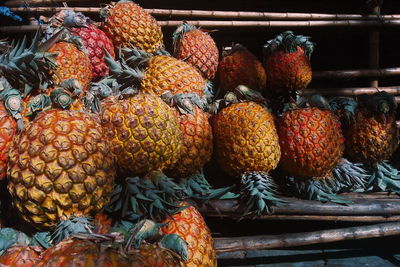 Close-up of pineapples for sale at market stall