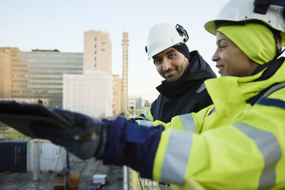 Two engineers working at construction site