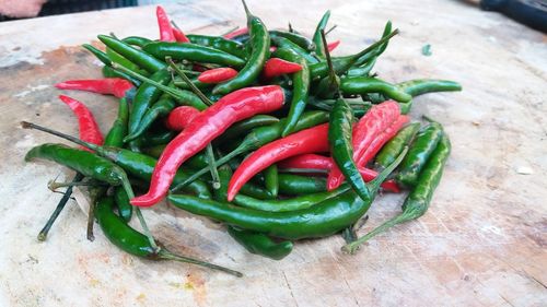 Close-up of red chili peppers on table